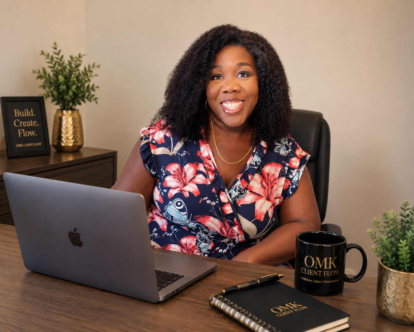 Opal working at her desk with a laptop in the OMK Clientflow office